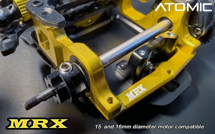 Atomic RC MRX 2WD pan car kit with sleek black chassis, detailed components, and racing wheels for high-performance RC racing.