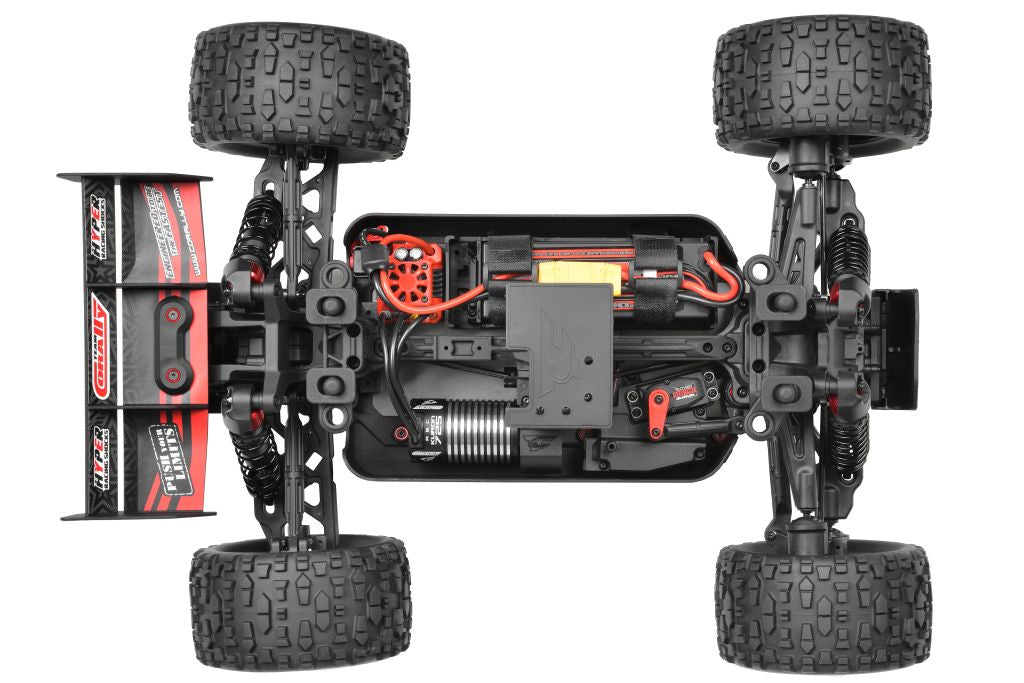 Team Corally Punisher 4S RTR monster truck in red with large tires and detailed body, ready for off-road racing.