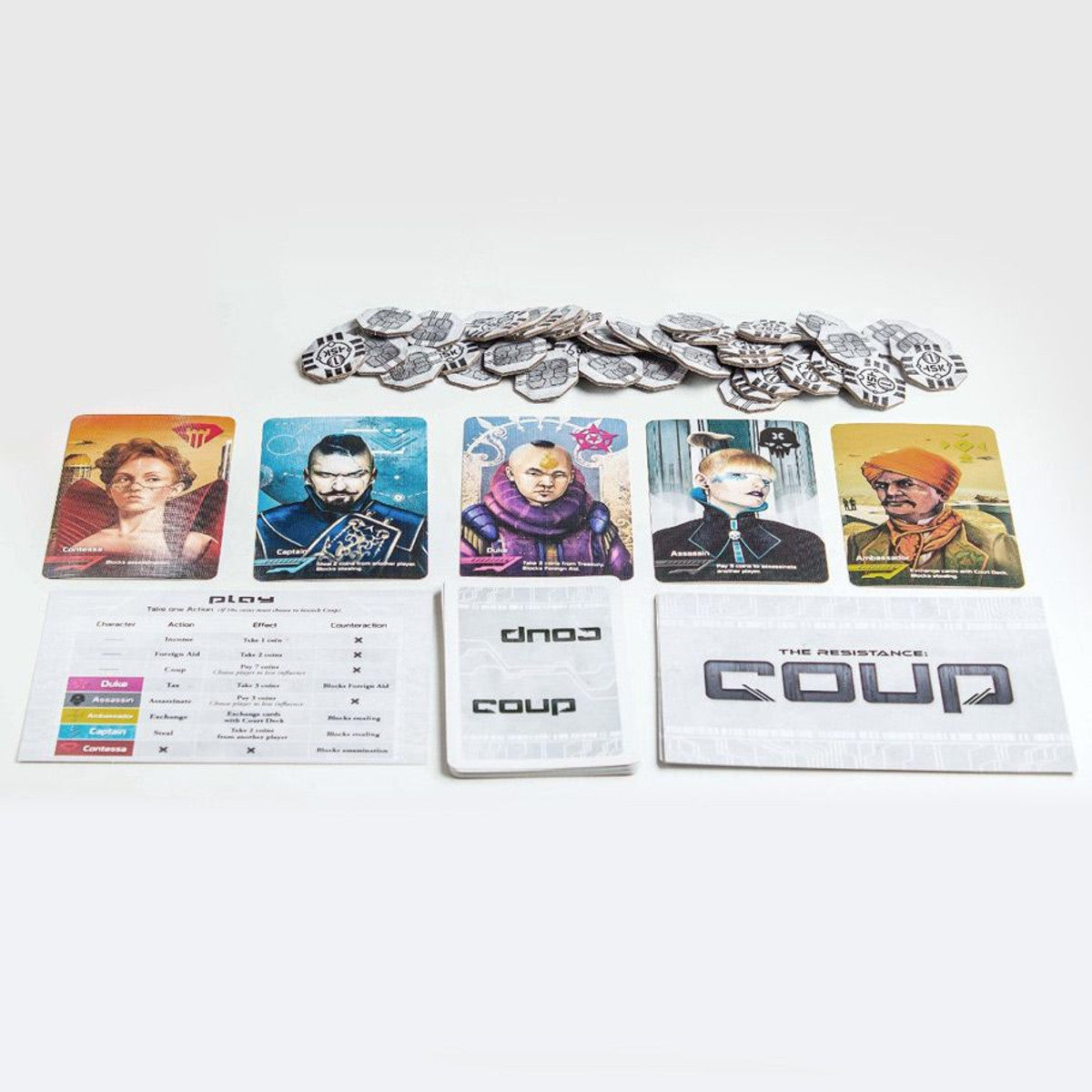 Coup card game by Indie Boards & Cards featuring a deck of cards and game components on a wooden surface.