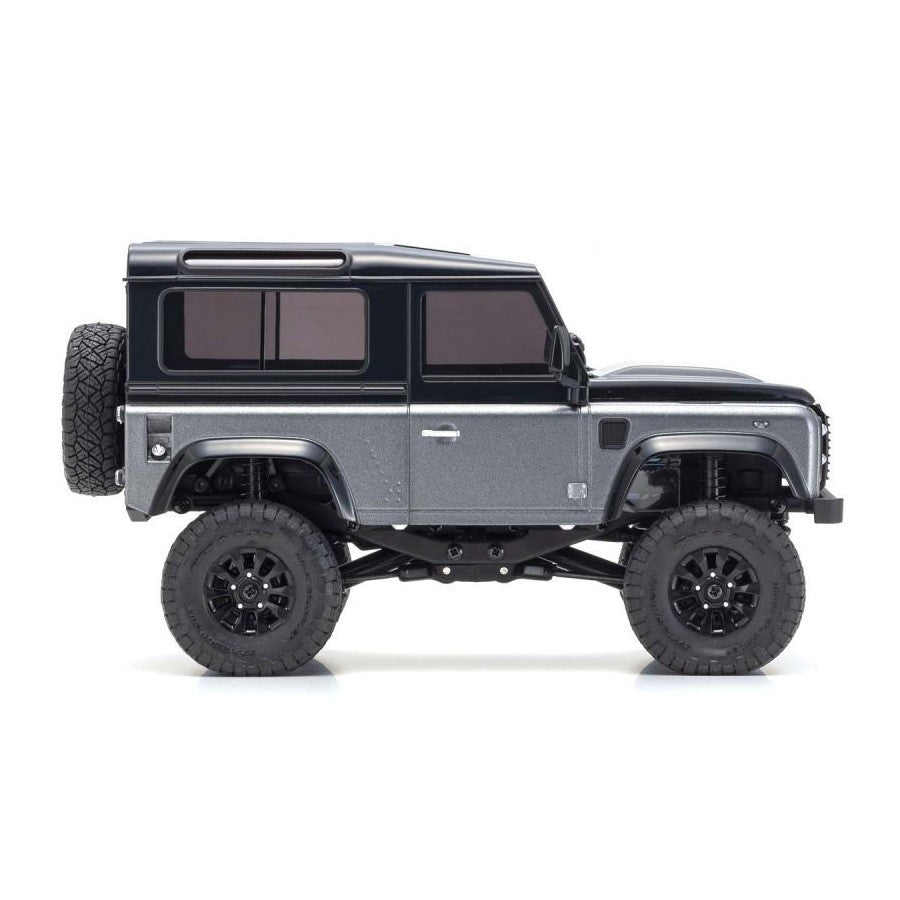 Kyosho Mini-Z MX-01 4x4 Land Rover Defender 90 RC car in gray and black, detailed interior and rugged exterior design.