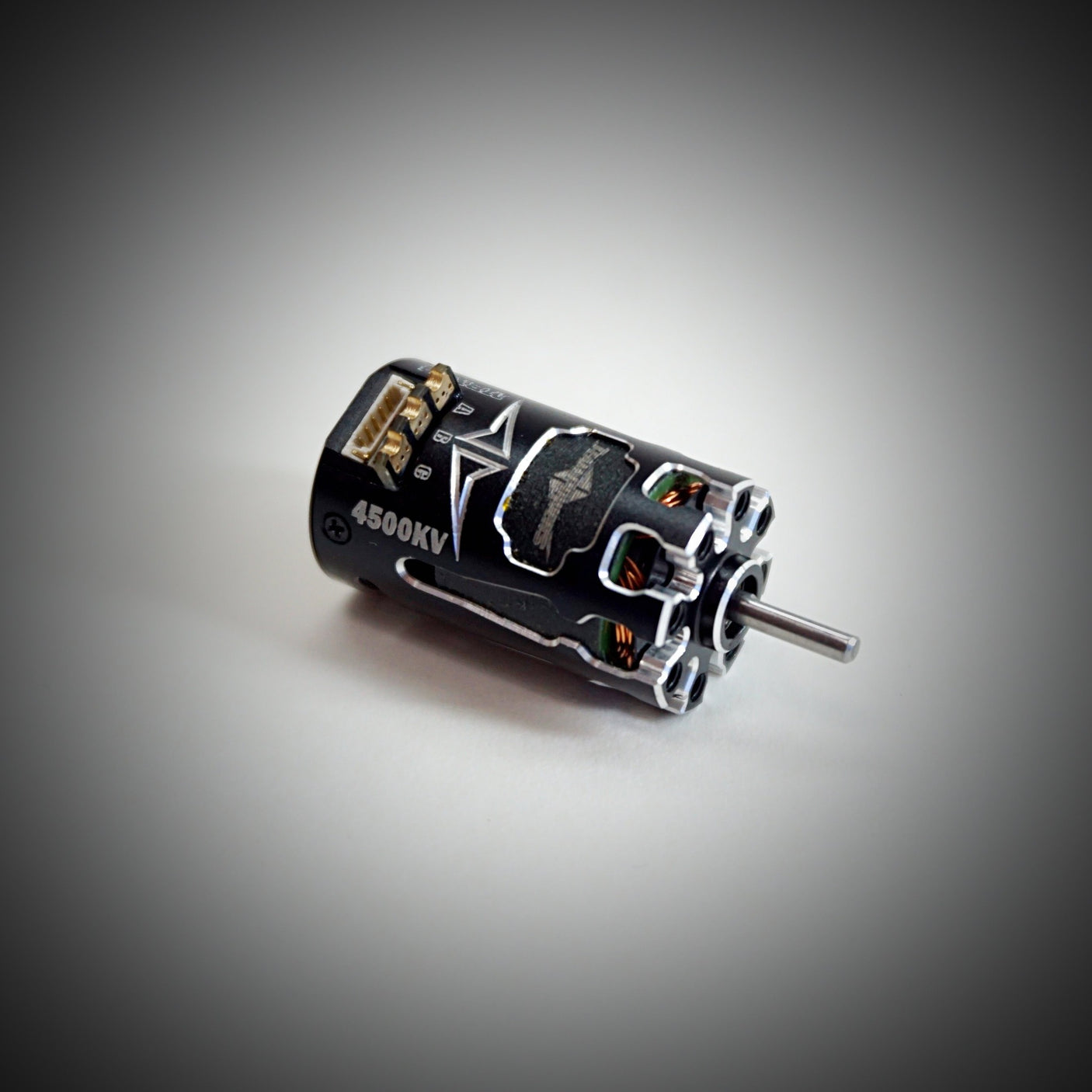 Team Powers MBX V4 Mini-Z RC car with sensored brushless motor, showcasing the detailed motor and compact racing chassis.