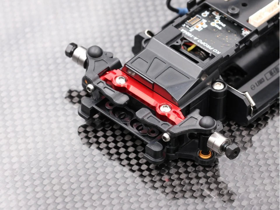 Black Radtec RC Mini-Z MR04 wide front upper arm mount for RC cars, shown on a clean surface.