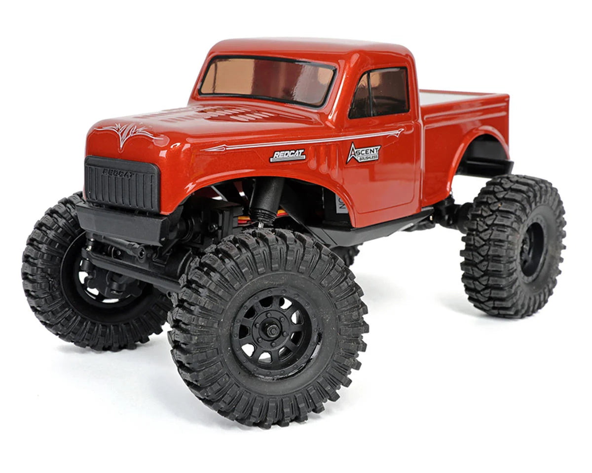 Redcat Ascent-18 1/18 scale 4WD RTR brushless rock crawler on rugged terrain with detailed suspension and large tires.