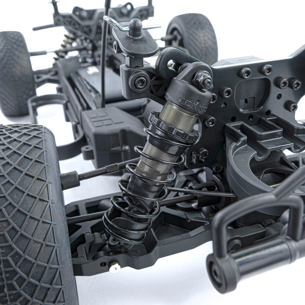 Tekno SCT410 2.0 1/10th scale 4x4 short course truck kit with top shock mount angle and suspension components.