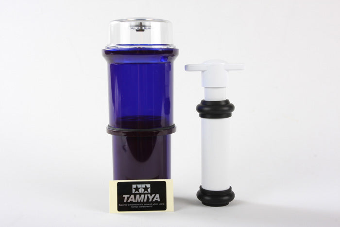 Tamiya Super Long Damper Oil Air Remover for RC cars, clear bottle with black cap and label, used for damping system maintenance.
