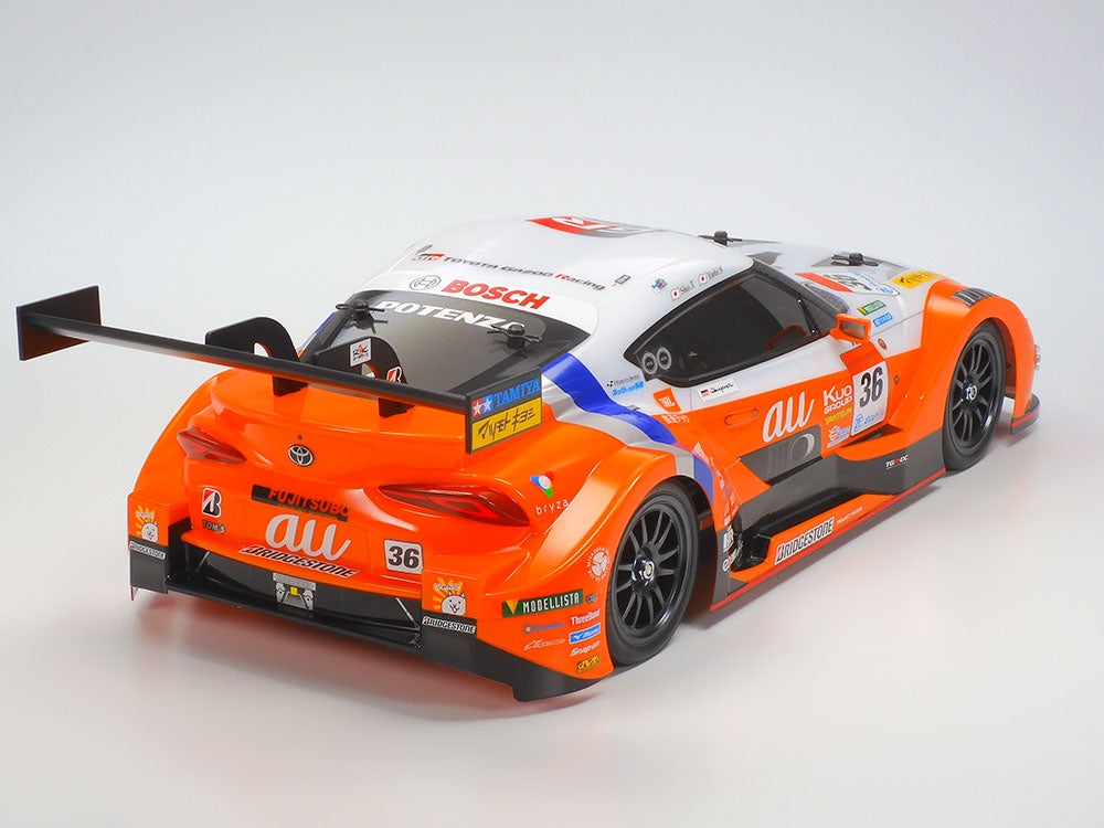 Tamiya TT-02 RC Toyota Supra GR kit with detailed body shell and racing decals for remote control car assembly