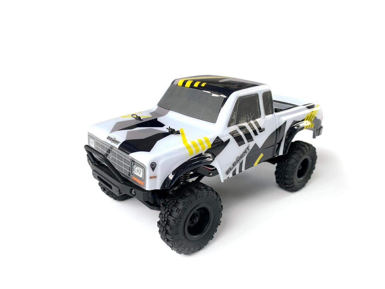 Black and yellow Element RC Enduro24 Sendero 1/24 RTR crawler with detailed chassis and off-road tires.