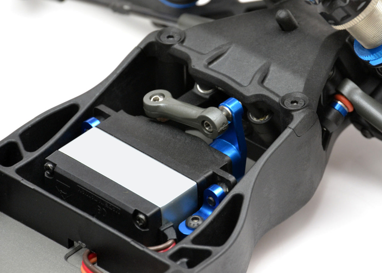 Exotek Racing AE Heavy Duty Servo Horn made of 7075 aluminum for RC car upgrades, shown in black with mounting holes visible.