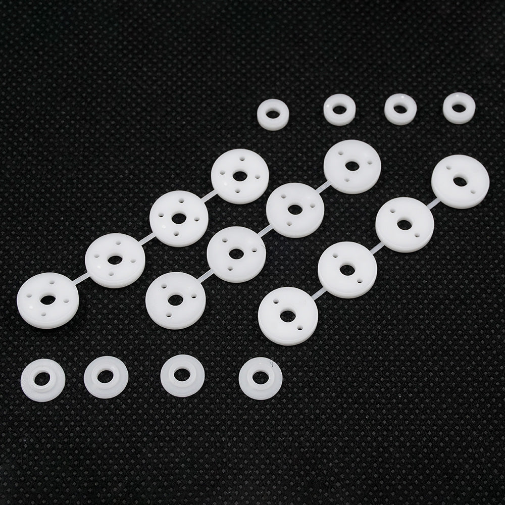 Xpress Composite 1.1mm Hole Piston and Spacer Set showing metallic pistons and spacers with detailed components.
