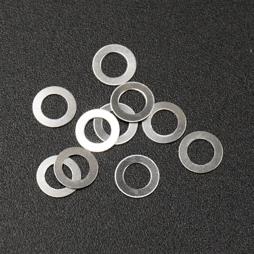 Set of ten Xpress steel spacers, 3x5x0.2mm, small metal components for electronics or DIY projects.