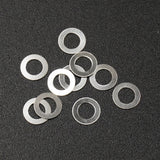 Set of ten Xpress steel spacers, 3x5x0.2mm, small metal components for electronics or DIY projects.