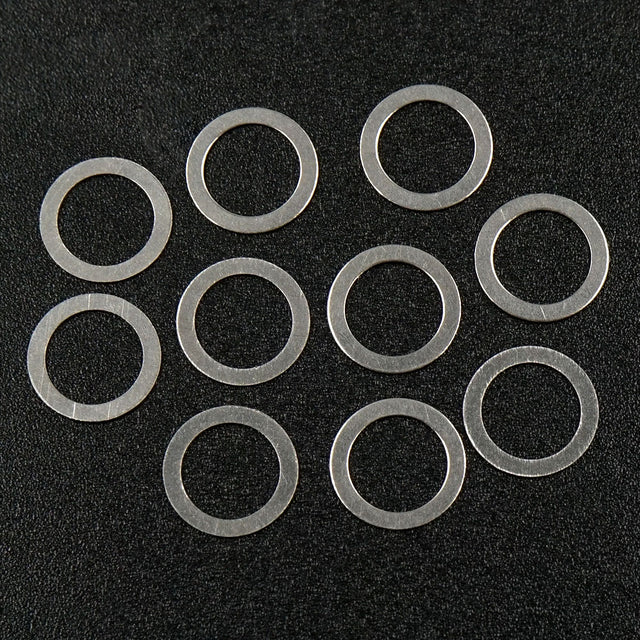 Set of 10 Xpress 5x7x0.2mm drive axle shims for precise axle adjustments, shown in the image.