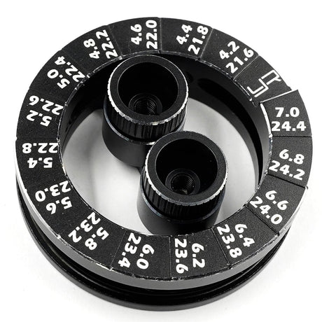 Yeah Racing aluminum round droop gauge for 1/10 touring car, showing detailed black aluminum construction and measurement markings.