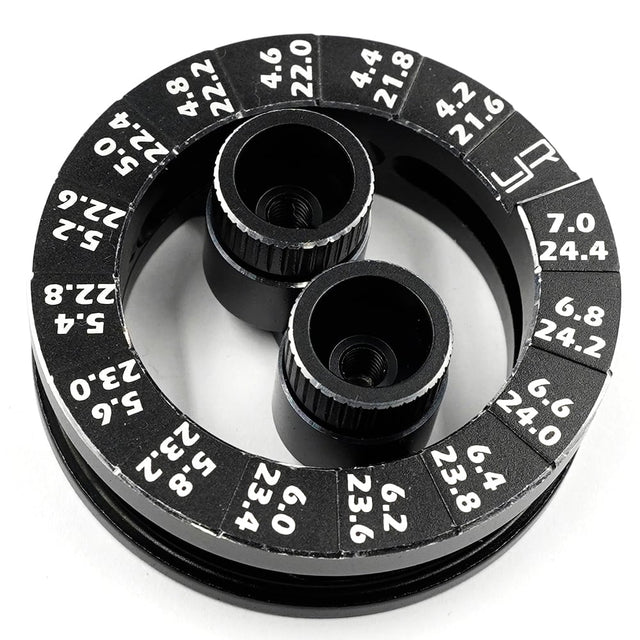 Yeah Racing aluminum round droop gauge for 1/10 touring car, showing detailed black aluminum construction and measurement markings.