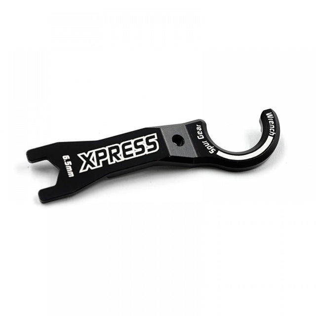 Xpress Spur+6.5mm wrench showing a metal hand tool with an open-end design for tightening or loosening bolts.