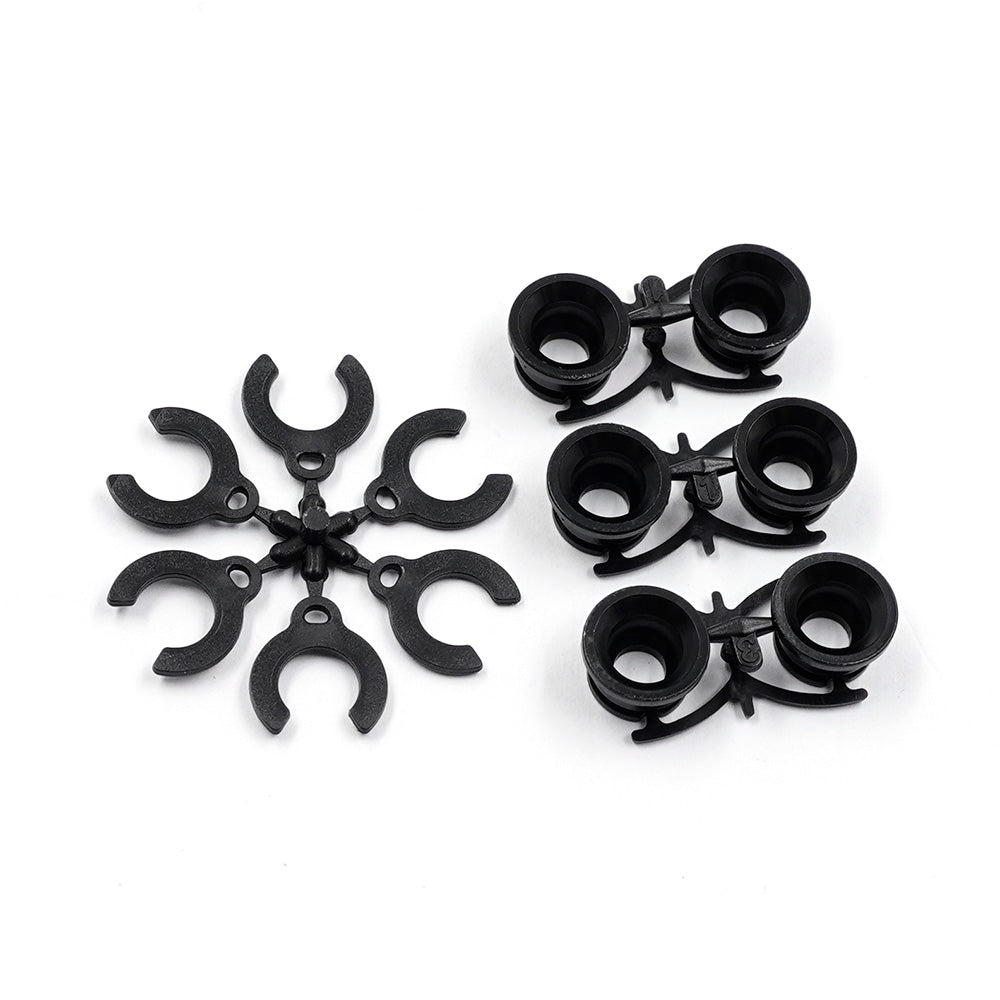 Xpress Pivot Inserts for Graphite Lower Arm, close-up view showing precision-machined metal components for RC car upgrades.