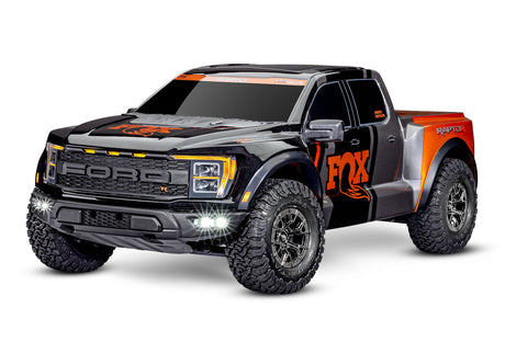 Traxxas Ford Raptor R 4X4 Ultimate remote control truck shown from a 3-quarter front view, featuring off-road tires and detailed body.