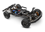 Traxxas Ford Raptor R 4X4 Ultimate remote control truck chassis viewed from a three-quarter front angle.