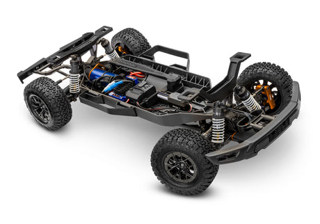 Traxxas Ford Raptor R 4X4 Ultimate remote control truck chassis viewed from a three-quarter front angle.