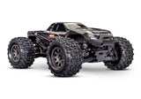 Traxxas Mini Maxx 1/16 scale electric RC monster truck with black body, front view showing detailed design and large tires.