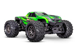 Traxxas Mini Maxx 1/16 scale RC truck with green body, front view showing detailed design and large wheels.