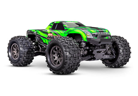 Traxxas Mini Maxx 1/16 scale RC truck with green body, front view showing detailed design and large wheels.