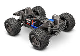 Traxxas Mini Maxx 1/16 scale electric RC truck with high chassis and detailed body in the image.