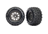 Traxxas Mini Maxx and XRT 4-inch rear wheels in gray, showing close-up of durable off-road RC vehicle wheels.