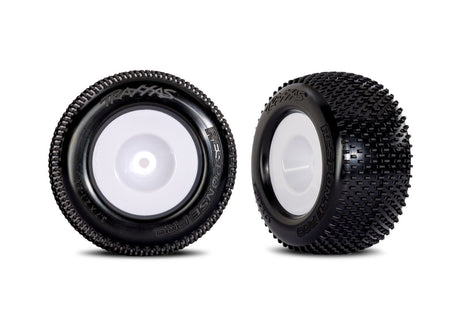 Pair of white dished wheels with Response Pro tires for Traxxas remote control cars, shown in a close-up image.