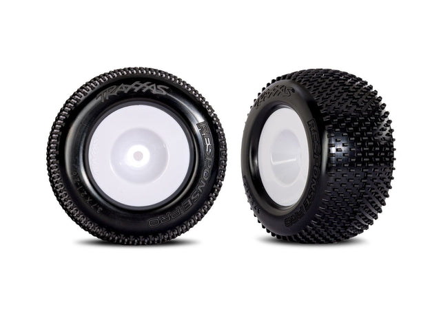 Pair of white dished wheels with Response Pro tires for Traxxas remote control cars, shown in a close-up image.