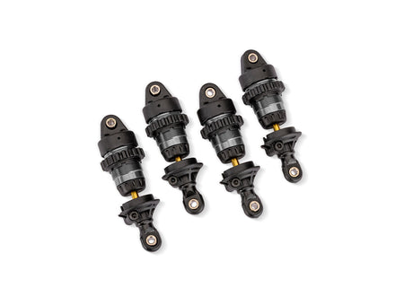 Gray aluminum mini GTR short shocks for Traxxas RC cars, shown in a close-up image highlighting their compact design.