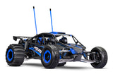 Traxxas Pro Scale Sand Car in blue, quarter front-right view showcasing detailed off-road RC vehicle with rugged tires.