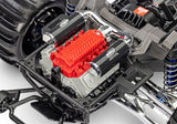 Traxxas Pro Scale Sand Car with detailed engine, showcasing off-road RC vehicle design and vibrant orange body with black accents.