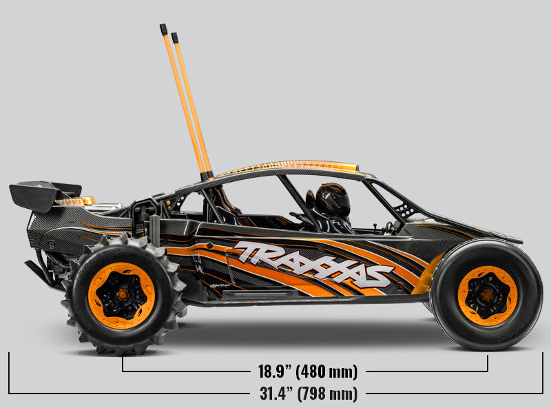 Orange Traxxas Pro Scale Sand Car shown from the side with detailed chassis and large off-road tires, designed for high-performance sand racing.