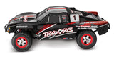 Traxxas 1/16 Slash 4X4 RC truck with detailed body and off-road tires, shown in a close-up side view.