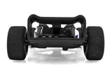 Team Associated F28 Formula RC 1/28 scale 2WD remote control car displayed outdoors with detailed body and racing design