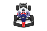 Team Associated F28 Formula RC 1/28 scale 2WD RC car on a track with detailed body and tires in a close-up shot