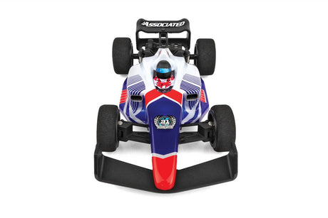 Team Associated F28 Formula RC 1/28 scale 2WD RC car on a track with detailed body and tires in a close-up shot