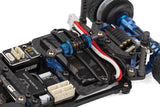 RC28 Team Associated RC car kit with central shock absorber, detailed chassis components, and brand-specific design features.