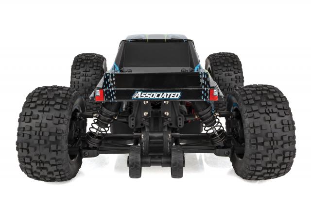 Team Associated Reflex 14MT 1/14 scale 4WD RC monster truck on a track, showcasing rugged tires and detailed body design.