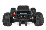 Team Associated Reflex 14MT 1/14 scale 4WD RC monster truck on a track, showcasing rugged tires and detailed body design.