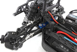 Team Associated Reflex 14MT 1/14 4WD RC monster truck with front steering and large tires, shown from the front angle.