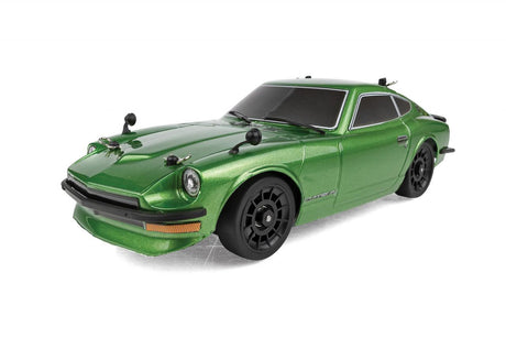 Team Associated SR27 Datsun 240Z RC car on track, detailed scale model with vibrant orange body and racing decals.