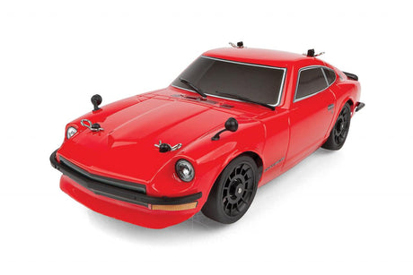 Team Associated SR27 Datsun 240Z RTR RC car on a track, detailed orange and black body with racing decals