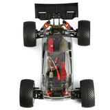LC Racing EMB-T Pro 1/14 4WD Truggy Pro Kit with detailed chassis and suspension components, ready for RC racing.