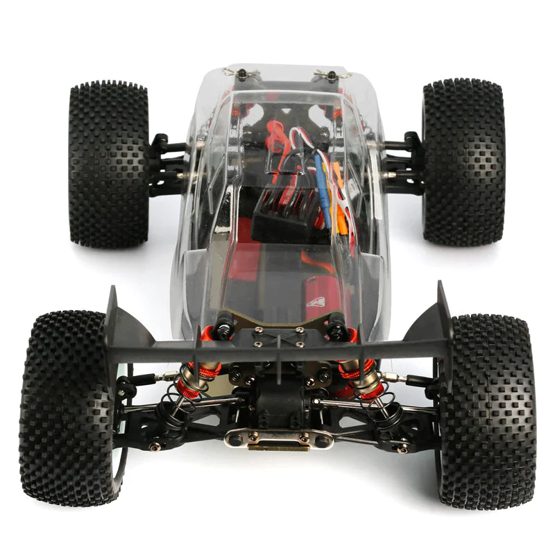 LC Racing EMB-T 1/14 scale 4WD Truggy Kit with detailed chassis and off-road tires, ready for assembly and racing.