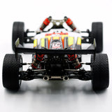 LC Racing EMB-1 1/14 scale 4WD RTR buggy, detailed close-up showing the chassis and off-road tires.