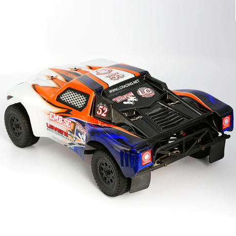 LC Racing EMB-SC 1/14 4WD RC short course truck with detailed body and large tires on a smooth surface.