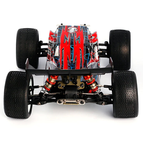 LC Racing EMB-T 1/14 scale 4WD RTR Truggy RC car with detailed body and off-road tires on a racing track.