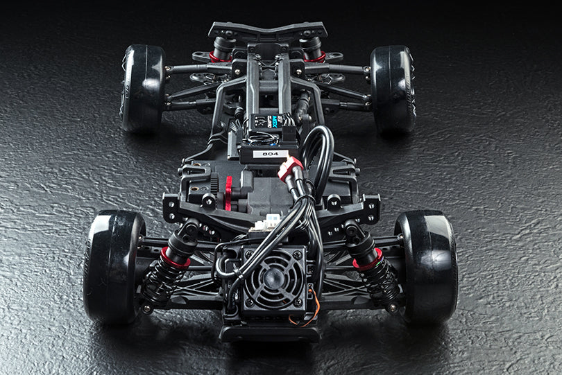 MST RMX 2.5 1/10 2WD brushless RTR drift car in iridescent purple with detailed body and racing tires